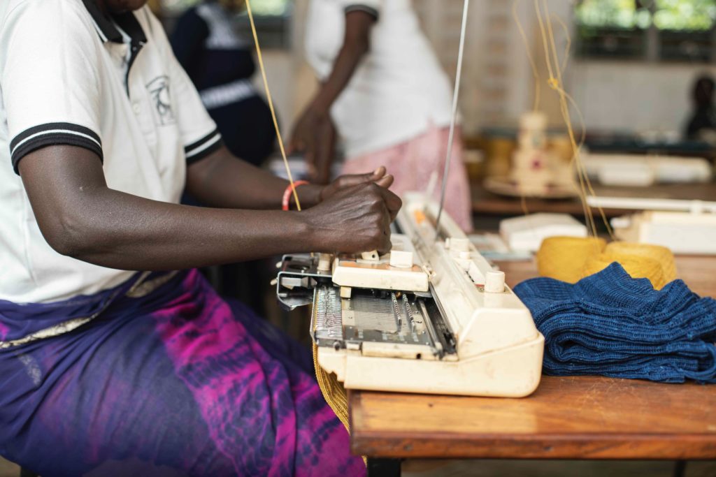 Uganda_woman_sewing_machine